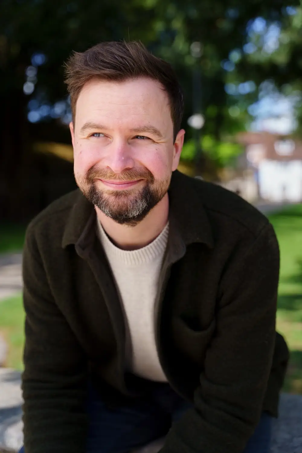 Alan, who runs burningsuit, sitting outdoors and smiling