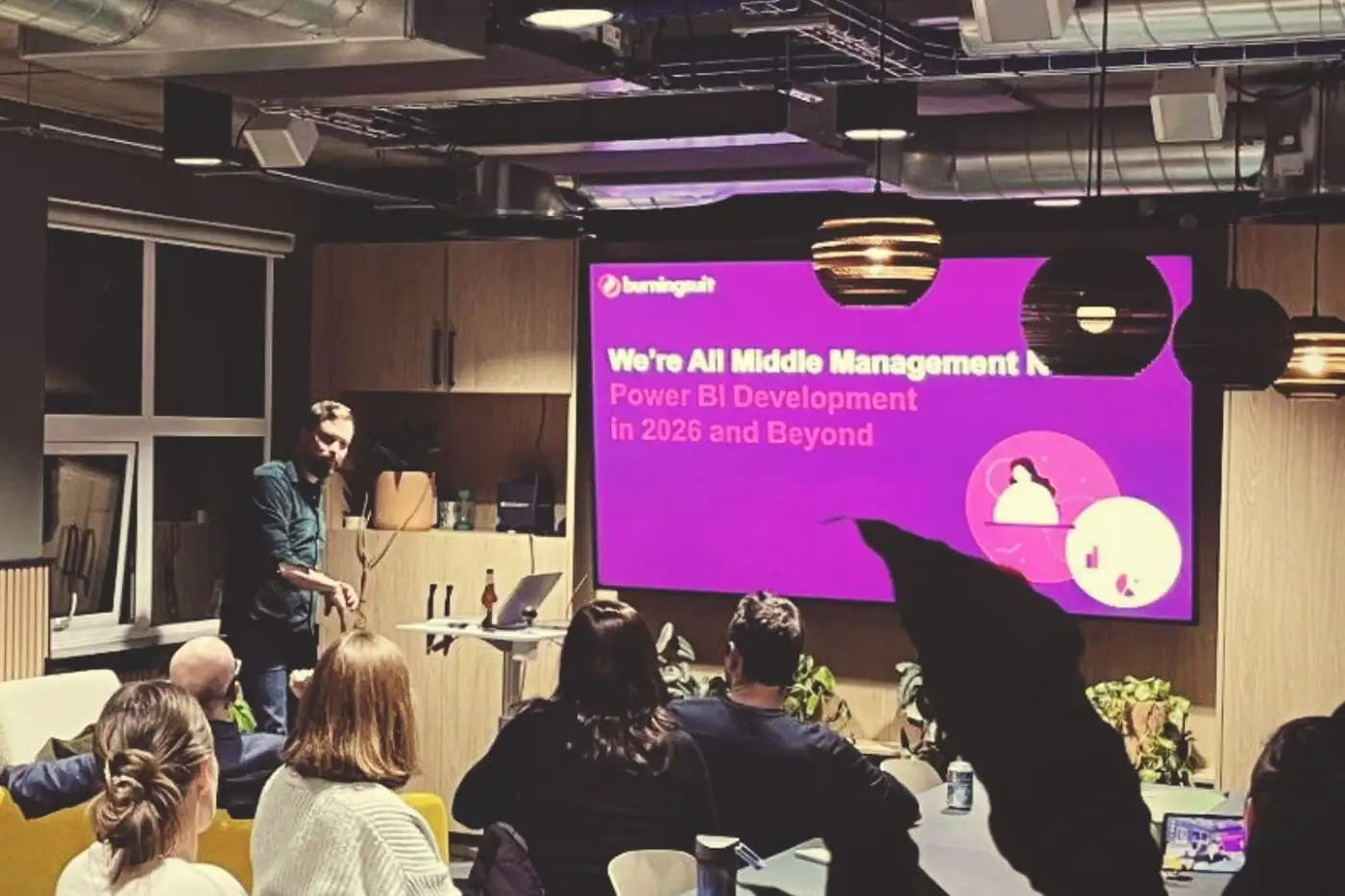 Alan giving the 'we're all middle management now' talk at a user group, the title slide up beside him